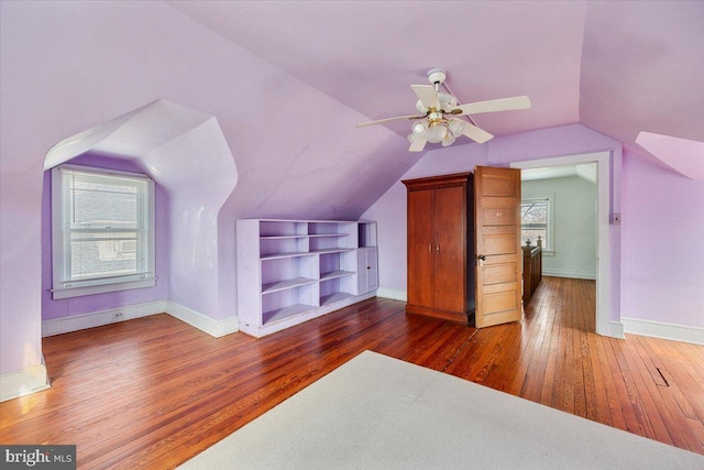 bonus room featuring vaulted ceiling, dark wood-type flooring, and ceiling fan