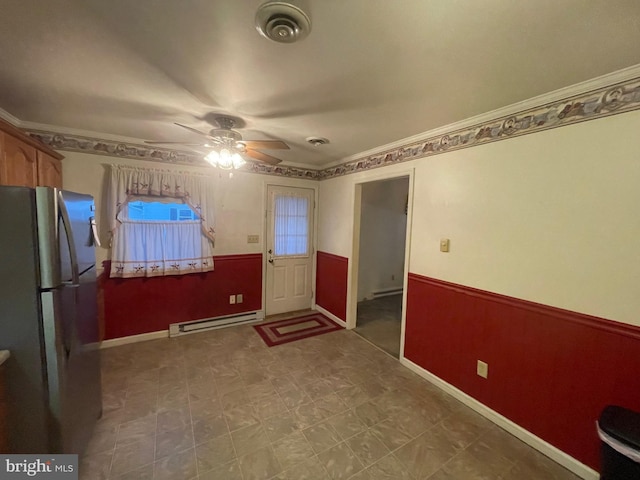 interior space with ceiling fan, ornamental molding, and a baseboard radiator