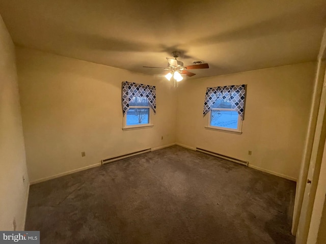 carpeted spare room featuring ceiling fan and a baseboard radiator