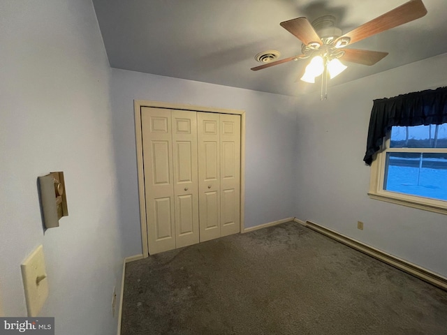 unfurnished bedroom featuring ceiling fan, a closet, and carpet floors