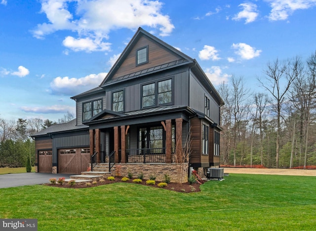 2003 Cornfield Creek Way, Pasadena, MD 21122 - view of front of house with covered porch, a standing seam roof, driveway, and a front yard