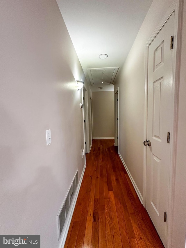 corridor featuring dark wood-type flooring