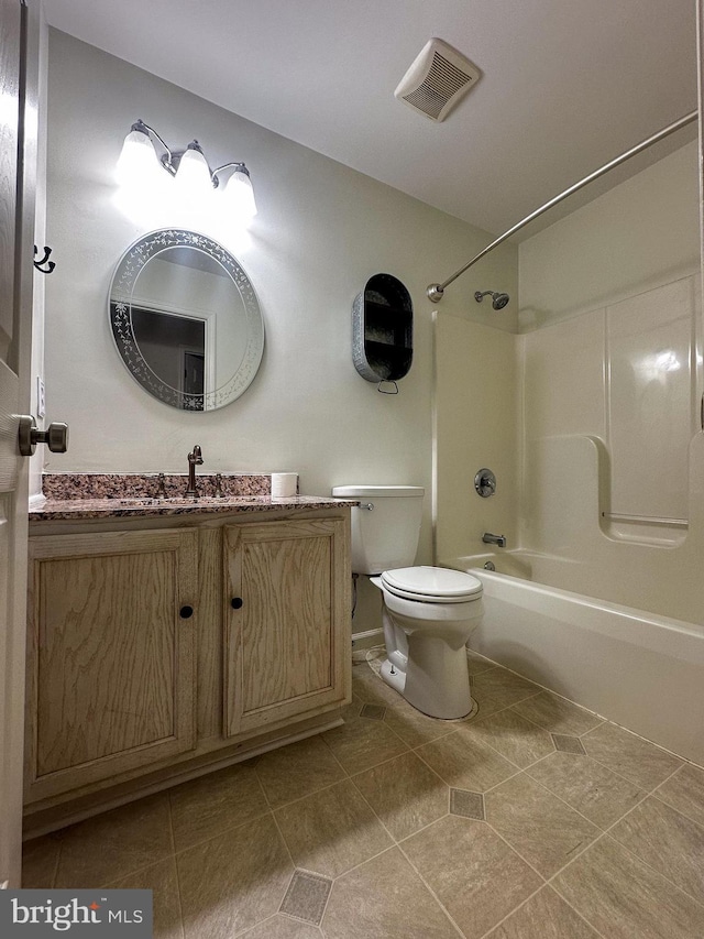 full bathroom with toilet, vanity, tile patterned flooring, and shower / washtub combination