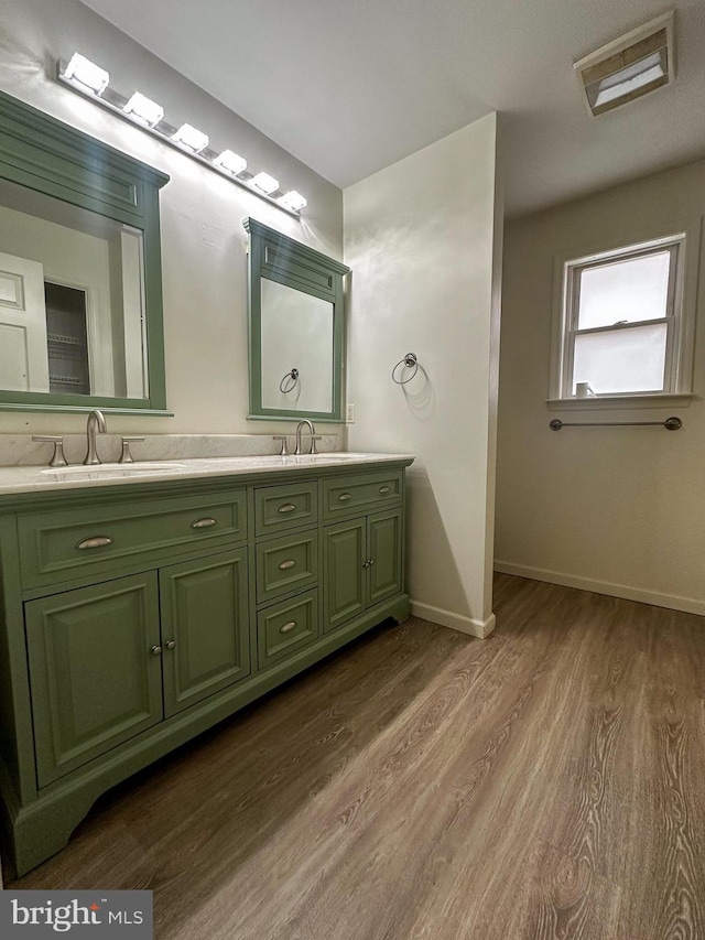 bathroom featuring vanity and wood-type flooring