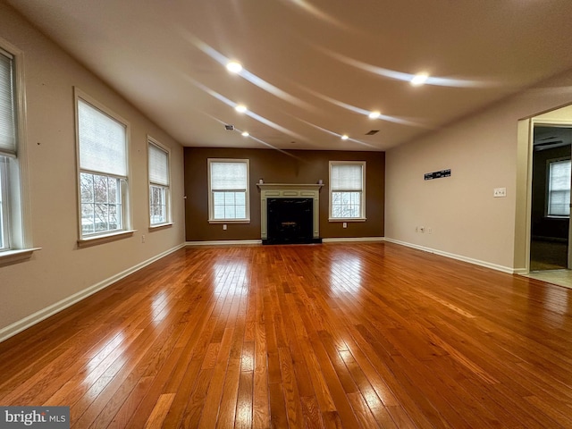 unfurnished living room featuring hardwood / wood-style floors