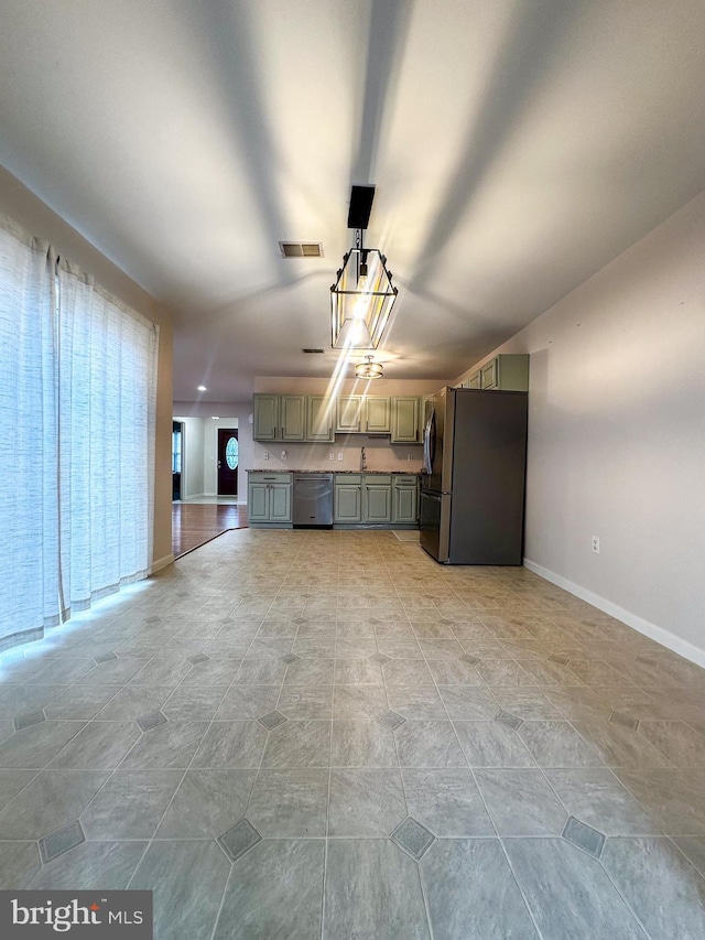 garage with stainless steel fridge