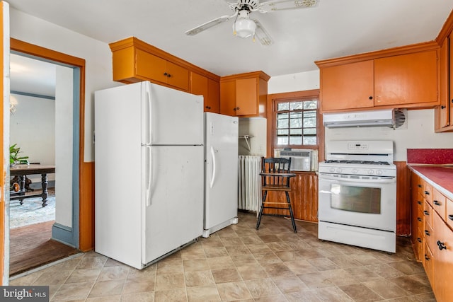 kitchen with radiator, white appliances, ceiling fan, cooling unit, and ventilation hood