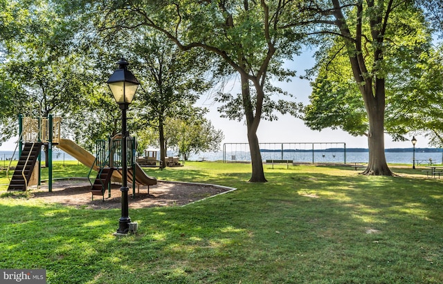 exterior space featuring a water view and a playground