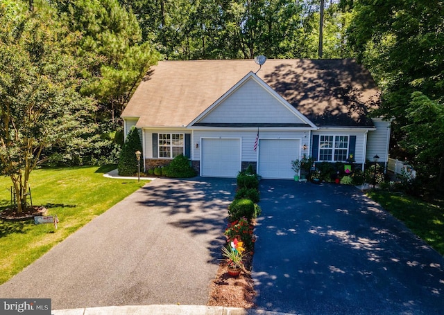 view of front of home featuring a garage and a front yard