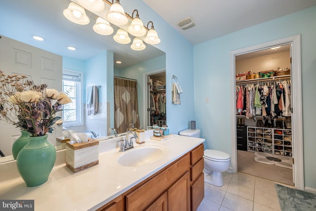 bathroom with vanity, a shower with shower curtain, tile patterned floors, and toilet