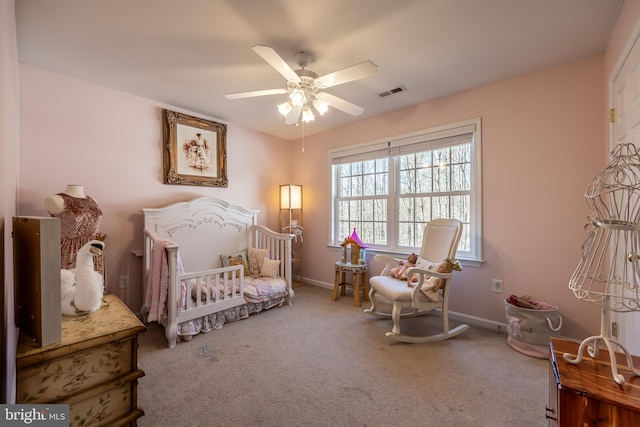 carpeted bedroom featuring ceiling fan