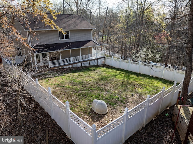 rear view of house featuring a lawn