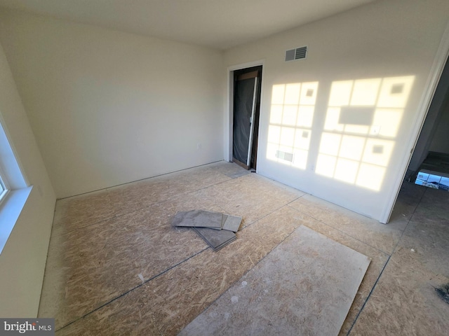 spare room featuring visible vents