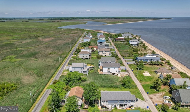 birds eye view of property with a water view and a residential view