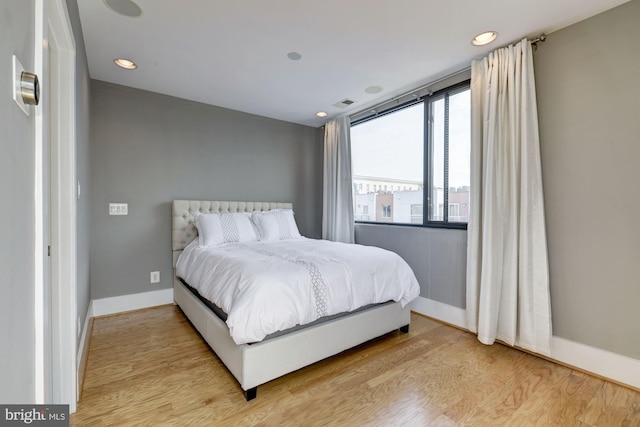 bedroom with light wood-type flooring