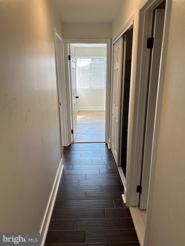 hallway featuring dark hardwood / wood-style floors