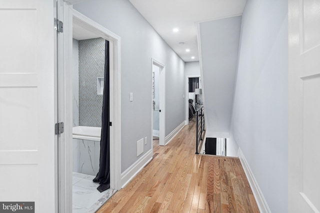 corridor featuring light wood-type flooring