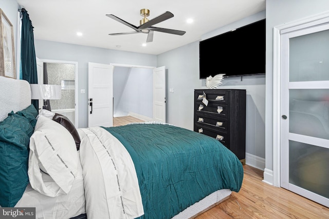 bedroom featuring ceiling fan and hardwood / wood-style flooring