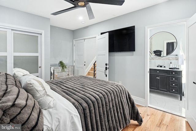 bedroom with ceiling fan and light hardwood / wood-style flooring