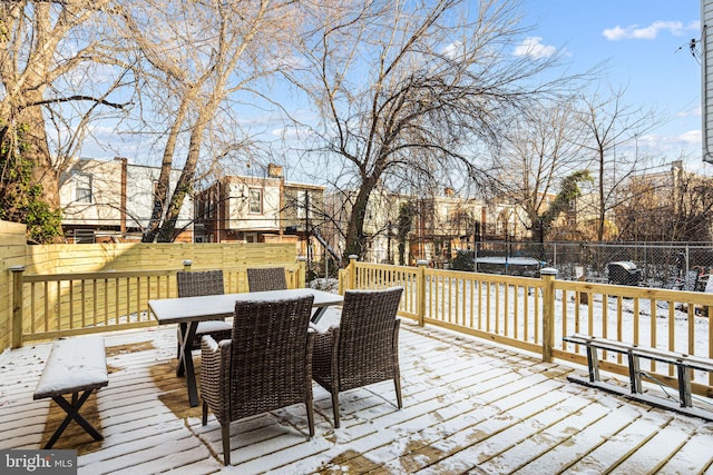 snow covered deck featuring a trampoline