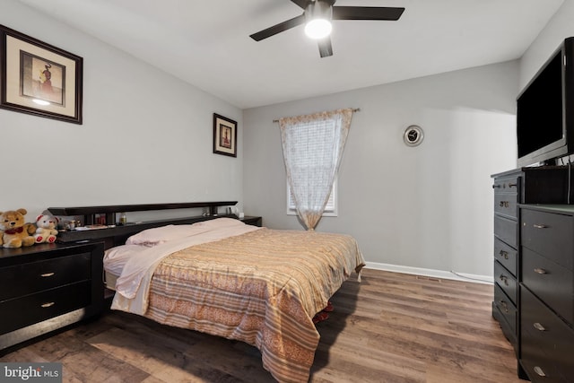 bedroom featuring ceiling fan and hardwood / wood-style floors