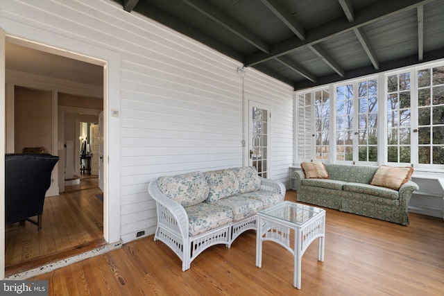 sunroom with beamed ceiling