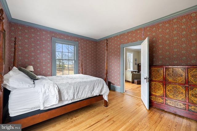 bedroom featuring hardwood / wood-style flooring and ornamental molding