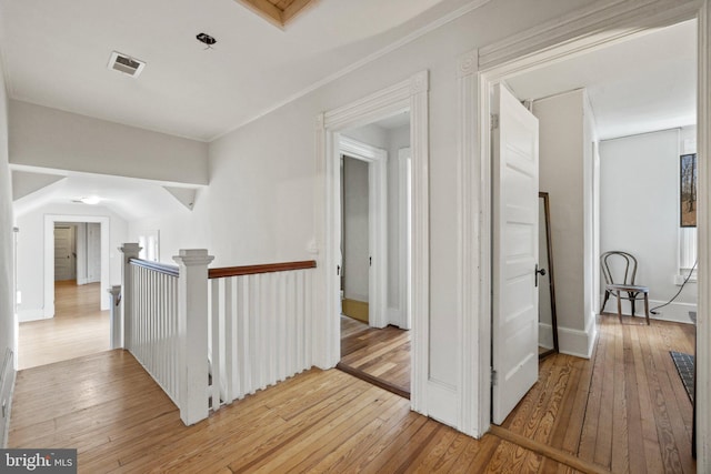 hall with light hardwood / wood-style floors