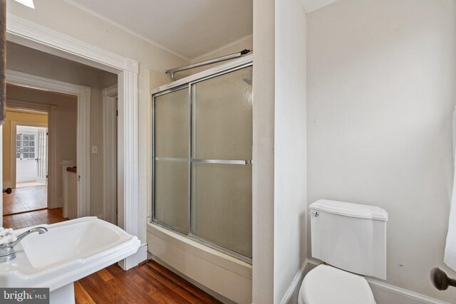 bathroom with hardwood / wood-style flooring, sink, and toilet