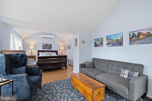 living room featuring lofted ceiling, hardwood / wood-style floors, and an AC wall unit