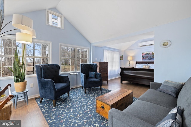 living room featuring high vaulted ceiling, hardwood / wood-style floors, and an AC wall unit