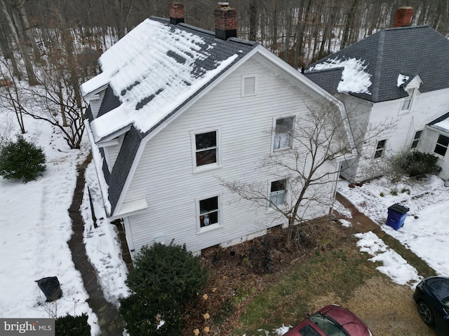 view of snow covered property