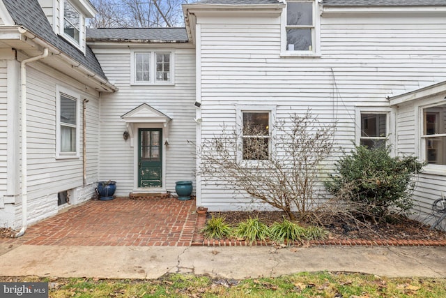 property entrance featuring a patio area