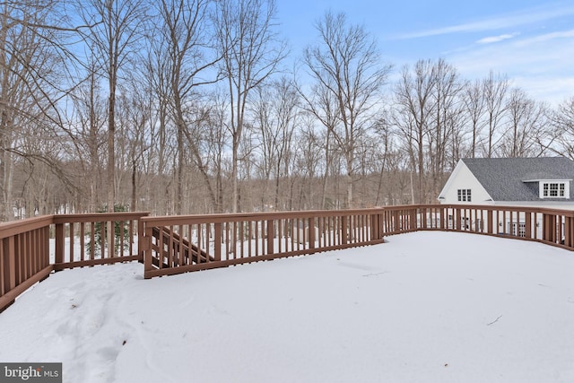 view of snow covered deck