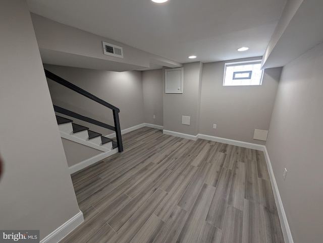 basement featuring light wood-type flooring