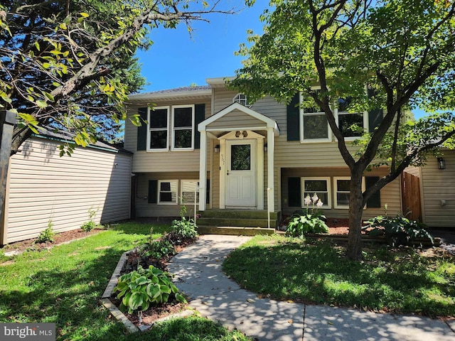 bi-level home featuring a front yard