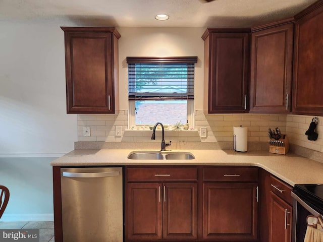 kitchen featuring stainless steel dishwasher, tile patterned floors, sink, and backsplash