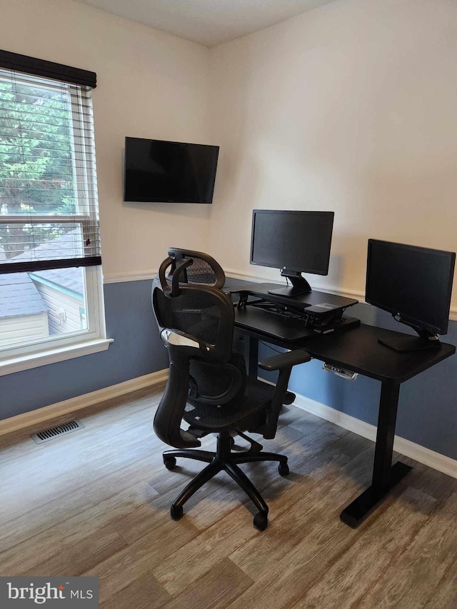 office with wood-type flooring