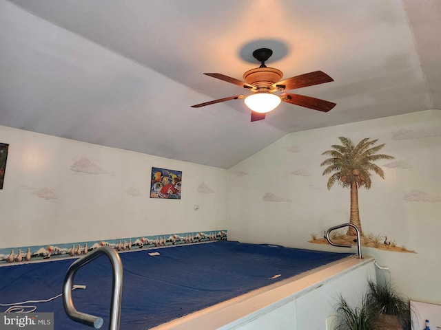 playroom featuring vaulted ceiling and ceiling fan