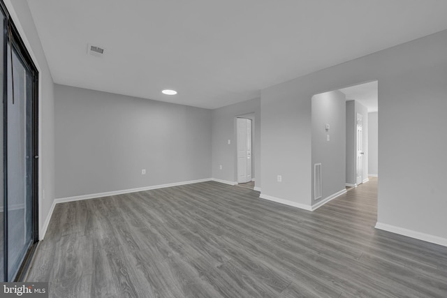 spare room with hardwood / wood-style floors