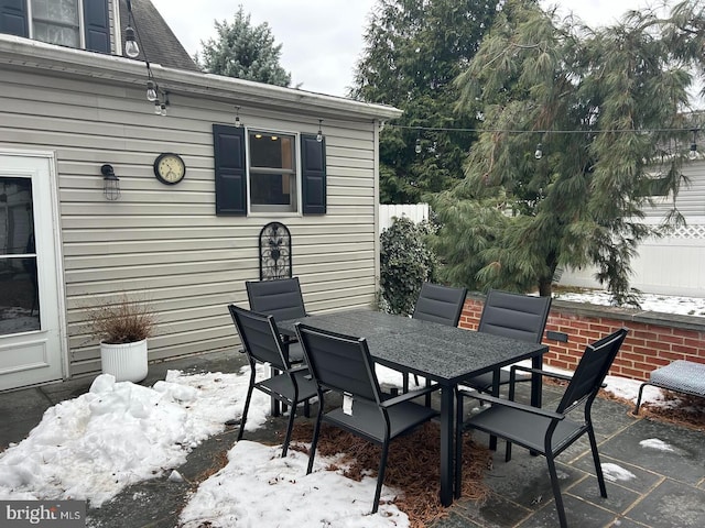 view of snow covered patio