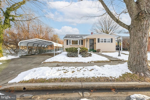 view of front facade with a carport