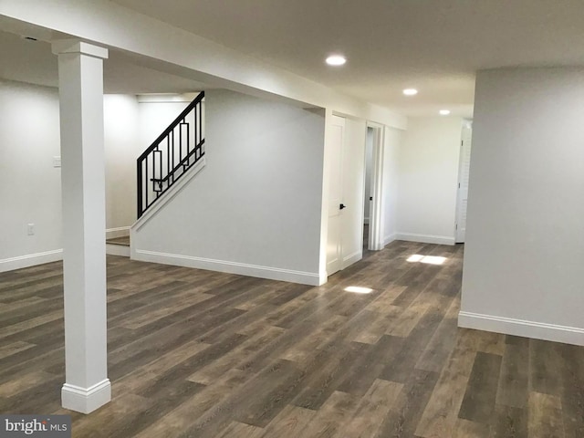 basement featuring dark hardwood / wood-style flooring