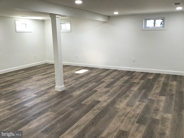 basement featuring dark hardwood / wood-style flooring