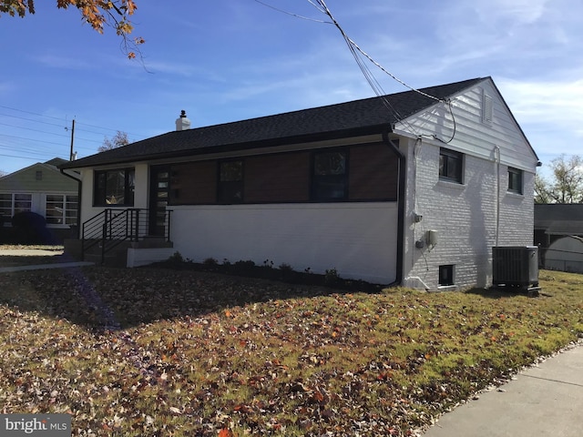 ranch-style house with cooling unit