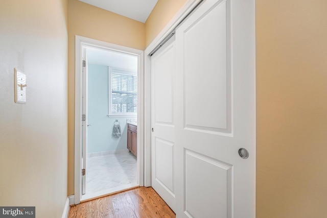 hallway featuring light wood finished floors