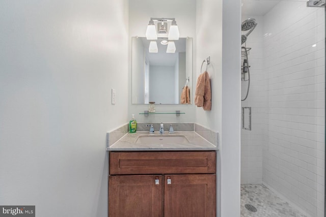 full bath with vanity and a stall shower