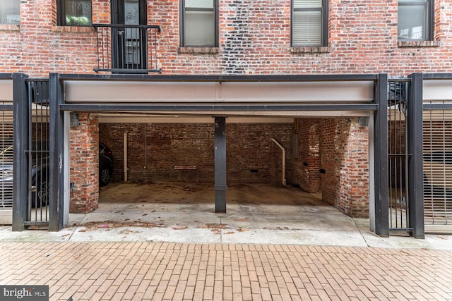 garage featuring decorative driveway