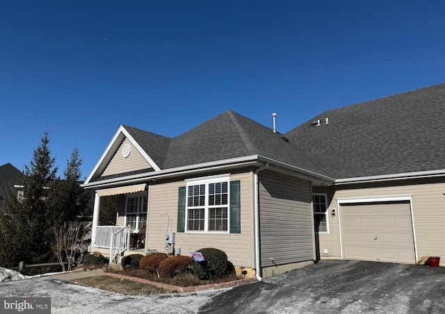 view of front of house with a garage and covered porch