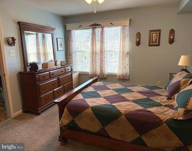 carpeted bedroom with multiple windows